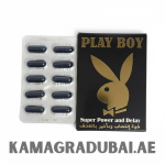 Black and gold packaging of Play Boy Super Power and Delay capsules, featuring the iconic bunny logo. The box text includes English and Arabic writing, and beside it is a silver blister pack containing ten dark capsules.