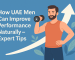 Illustration of a fit man lifting a dumbbell beside the title “How UAE Men Can Improve Performance Naturally – Expert Tips” on a clean blue background with an upward arrow.