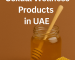 Text “Honey-Based Sexual Wellness Products in UAE” aligned above a honey jar and honeycomb on a brown background